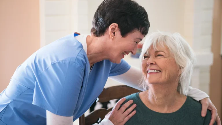  Nurse taking care of elderly lady