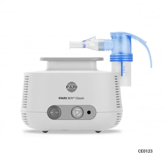  A white PARI BOY Classic nebulizer machine with a blue and clear nebulizer cup and mouthpiece attached.