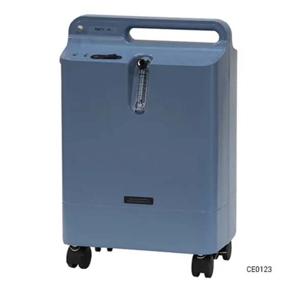 A medium blue, rectangular home oxygen concentrator with a top handle and wheels, featuring a visible flow meter and the "EverFlo" and "Respironics" brand names on the front.
